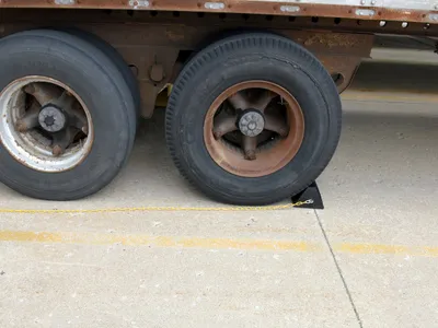 Vestil OH-15-YEL wheel chock shown from an alternate angle