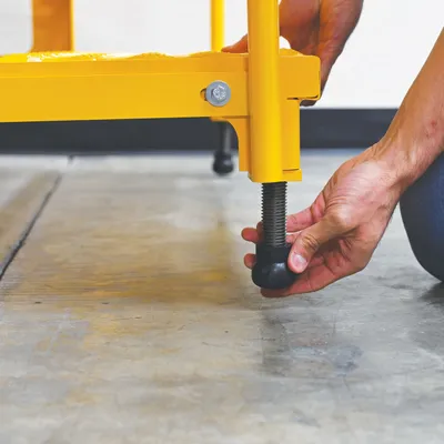 Vestil ASP-48-3-HR adjustable step stands with handrail shown from an alternate angle