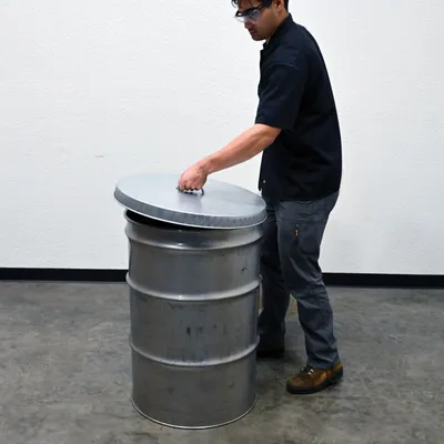 Vestil DC-245-H galvanized steel drum cover shown from an alternate angle