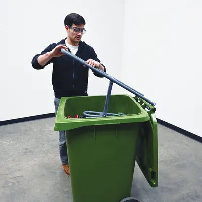 Vestil MBC-1513-14 manual trash bin compactor shown from an alternate angle