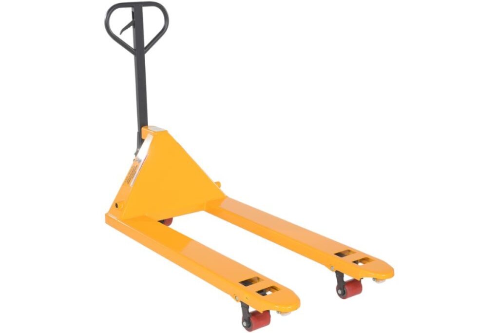 Manual pallet jack moving stacked goods in a compact warehouse